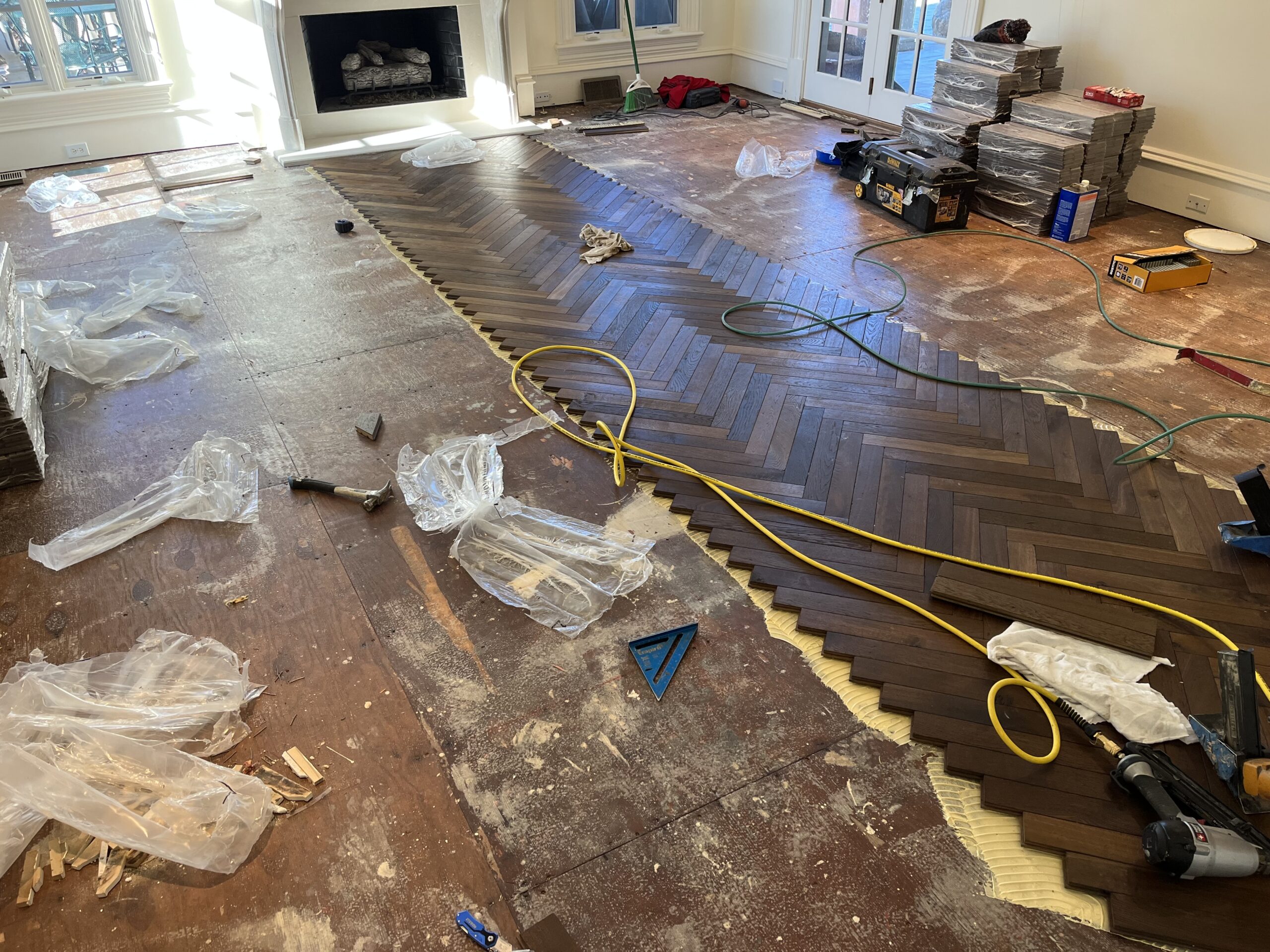 laying herringbone pattern wood floor