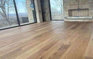 Engineered hardwood flooring in a Nashville home with stone walls